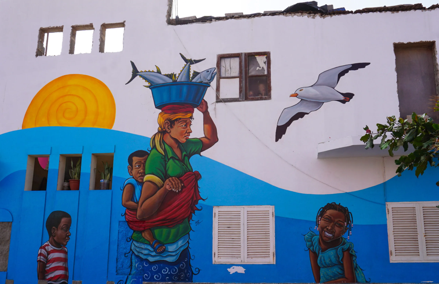 Colourful mural in Santa Maria featuring a fishmonger, child and seagull, Sal Island